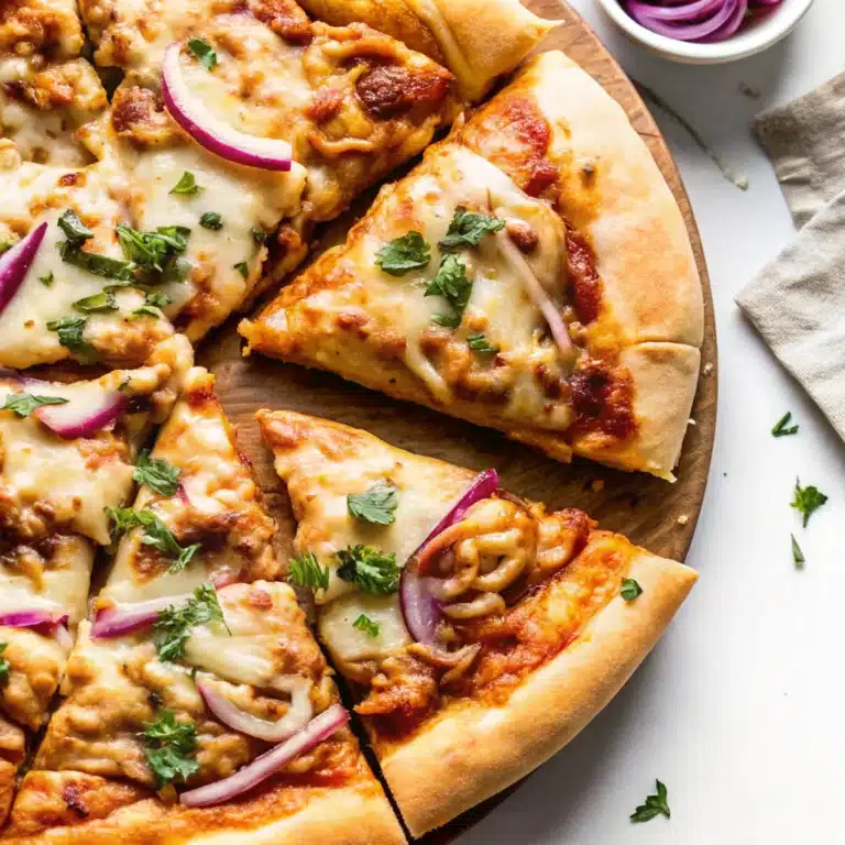 BBQ Chicken Pizza slices topped with mozzarella, smoked gouda, red onion, and cilantro